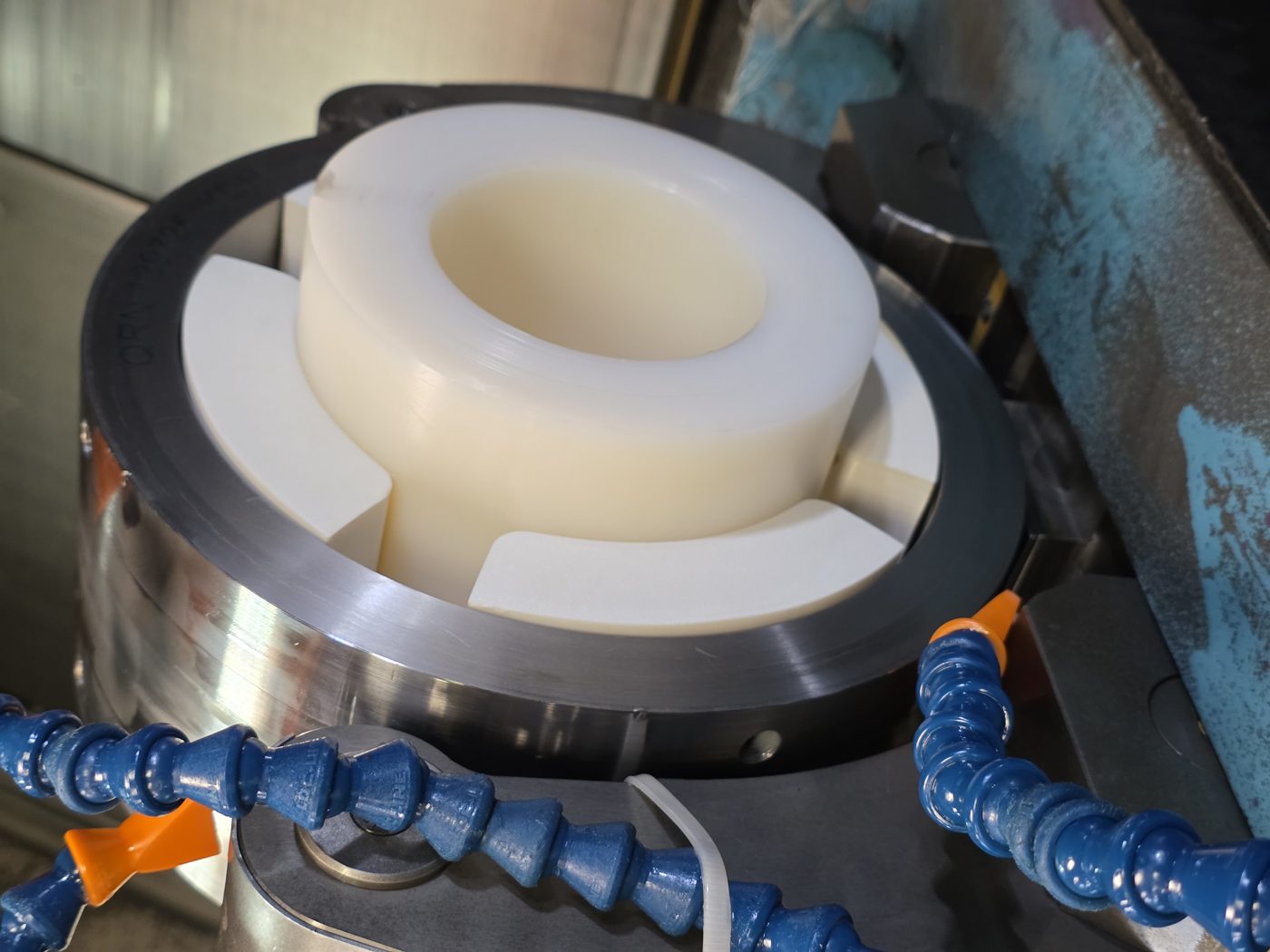 Custom 3D-printed poka-yoke fixture holding a machined part on a CMM