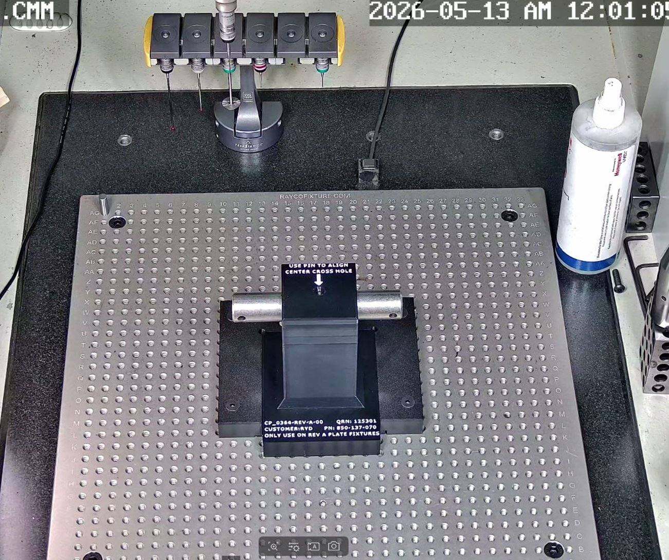 Live CMM camera view of a part held in a custom fixture during remote proveout